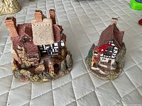 Both Lilliput Lane cottages side by side showing scale and exterior details