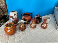 Group shot of all eight pottery pieces