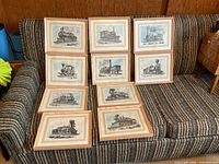 All ten framed locomotive prints on sofa