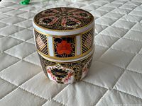 Porcelain table lighter assembled with lid on, showing Imari 1128 design