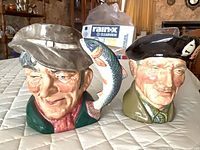 Front view of both Royal Doulton character jugs