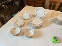 Grouped view of all plates and bowls on table