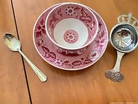 Cup, saucer, strainer, spoon overview