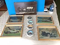 All items: plaque, four prints, four ashtrays displayed together