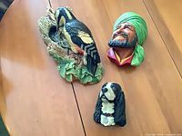 All three Bossons chalkware plaques on table