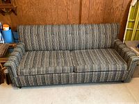 Front view of striped tweed loveseat