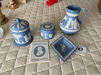 All four Wedgwood jasperware items together showing design and scale