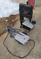 Both saws side by side on driveway