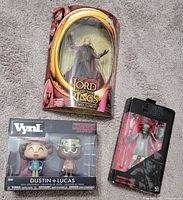 Group shot of all three packaged collectible figures