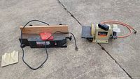 Both power tools side by side on concrete showing overall condition