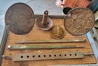 Overall lot showing all cast-iron pieces on tray