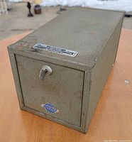 Perspective view showing entire safe, front key in lock, Hercules badge