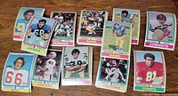 First group of 1974 Topps football cards laid out on table