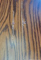 Necklace and bracelet full length on wood surface