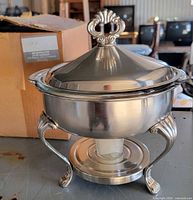 Complete chafing dish assembled with lid and stand