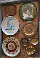 All eight metal trays and dishes laid out