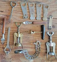 Group shot of all corkscrews, openers and bracket