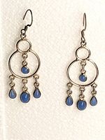 full view of both earrings showing overall design and stones