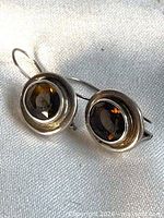 Front view of both sterling silver smoky quartz earrings