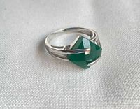 Ring angled view showing silver band and green onyx stone