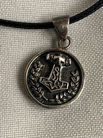 Front view of sterling silver Mjölnir pendant on cord
