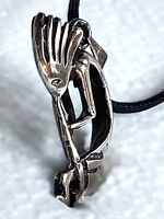 Front view of sterling silver Kokopelli pendant on cord