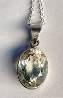 Front view of sterling silver necklace with lemon topaz pendant