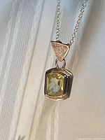 Front view of lemon topaz pendant on chain