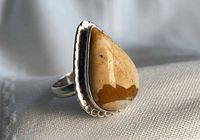 Front view of sterling silver ring with picture jasper cabochon