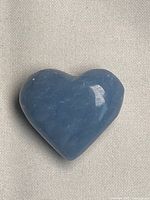 Front view of polished blue angelite heart