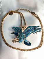 Full view of necklace with eagle pendant laid flat