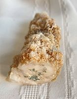 Oblique view of calcite crystal specimen showing granular surface and agate core