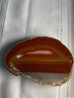 Front view showing polished banded surface colours