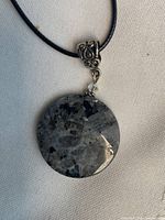 Front view of larvikite pendant on cord