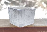 Clear calcite cube front view showing transparency