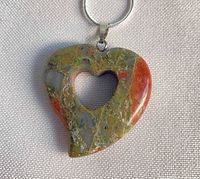 Front view of unakite heart pendant on silver chain