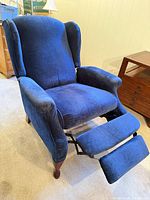 front view with footrest extended showing upholstery and mechanism