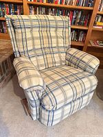Front view of plaid fabric manual recliner rocker chair