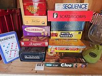 All boxed games and dominoes arranged on shelf