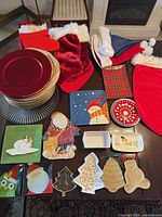 Overall lot with chargers, trays, stockings, hats, molds and small plates