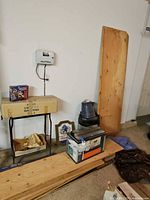Aquarium, lumber boards, keg, coffee pot, Hamm's sign, boxes visible