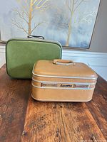 Tan Laurentian and green Jetliner cases front view