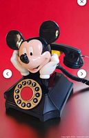 Full view of Mickey Mouse novelty desk phone with handset and dial
