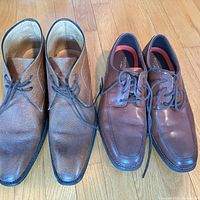 Both pairs of shoes side by side showing uppers and laces