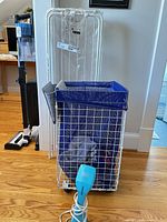 Steamer, drying rack, hamper, towels overall view