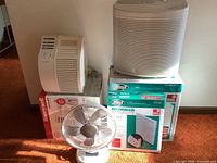 All items grouped: two air purifiers, table fan, two filter boxes