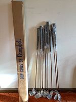 Eight new Campbell golf clubs in plastic wrap with original box