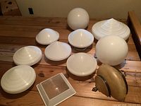 group shot of all globes, domes, square lens and fixtures