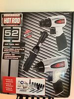 Front of sealed Powerbuilt Hot Rod Series 52-piece air tool set box showing three air tools