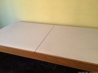 Top view of rectangular dining table showing centre split for underside leaf